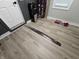 Entryway with damaged flooring at 3836 N Wittfield St, Indianapolis, IN 46235
