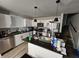 Modern kitchen with white cabinets, stainless steel appliances, and granite countertops at 3836 N Wittfield St, Indianapolis, IN 46235