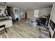 Spacious living room with light hardwood floors, neutral walls, and natural light at 3836 N Wittfield St, Indianapolis, IN 46235