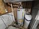 Image shows the water heater and water softener for the home at 3836 N Wittfield St, Indianapolis, IN 46235