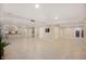 Finished basement with tile flooring, a projector, and kitchenette at 3853 Abney Highland Dr, Zionsville, IN 46077