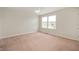 This bedroom features neutral walls, ample natural light, and plush carpet at 3853 Abney Highland Dr, Zionsville, IN 46077