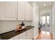 Convenient butler pantry with ample storage and counter space, connecting to a dining area at 3853 Abney Highland Dr, Zionsville, IN 46077
