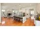 Beautiful open kitchen featuring an island with seating, stainless appliances, and seamless living area access at 3853 Abney Highland Dr, Zionsville, IN 46077