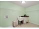 Laundry room features wire shelving, utility sink, and vintage-style cabinets at 3853 Abney Highland Dr, Zionsville, IN 46077