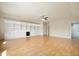 Spacious living room features built-in shelving, cabinets, and a ceiling fan at 3853 Abney Highland Dr, Zionsville, IN 46077