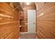 Cozy walk-in closet features cedar planking, shelving, and neutral carpet at 3853 Abney Highland Dr, Zionsville, IN 46077