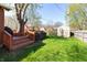Outdoor space with a deck, green grass, shed and mature tree at 40 S Restin Rd, Greenwood, IN 46142