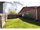 Expansive backyard featuring lush green lawn, wooden fence, and mature trees at 40 S Restin Rd, Greenwood, IN 46142