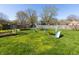 Spacious backyard features a swingset, slide, trampoline, and garden at 40 S Restin Rd, Greenwood, IN 46142