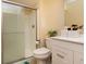 Bright bathroom featuring a shower, vanity, and plant at 40 S Restin Rd, Greenwood, IN 46142