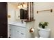 Bathroom featuring a modern vanity, decorative accents, and a toilet with tiled flooring at 40 S Restin Rd, Greenwood, IN 46142