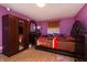 Bedroom featuring a wooden bed frame and stylish furnishings at 40 S Restin Rd, Greenwood, IN 46142