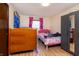 Bright bedroom with two beds, gray wardrobe and natural light at 40 S Restin Rd, Greenwood, IN 46142