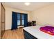 Comfortable bedroom featuring a window with blinds and curtains and a desk area at 40 S Restin Rd, Greenwood, IN 46142