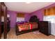Bedroom featuring a wooden bed frame and stylish furnishings at 40 S Restin Rd, Greenwood, IN 46142