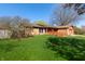 Well maintained single-story home with a well-kept lawn and mature trees in a peaceful residential neighborhood at 40 S Restin Rd, Greenwood, IN 46142