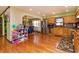 Open kitchen flowing into the dining room with modern stainless appliances and wooden cabinets at 40 S Restin Rd, Greenwood, IN 46142