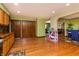 Spacious kitchen features wood floors, and views into the dining and living room at 40 S Restin Rd, Greenwood, IN 46142