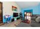 Living room featuring tiled floors, a television, and seamless transition to other spaces at 40 S Restin Rd, Greenwood, IN 46142