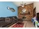 Comfortable living room with a brick fireplace, television, and spacious seating at 40 S Restin Rd, Greenwood, IN 46142