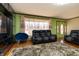 Comfortable living room features contemporary furnishings, stylish curtains, and well-maintained hardwood floors at 40 S Restin Rd, Greenwood, IN 46142