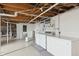 Utility basement with laundry area, exposed pipes, and concrete floor with utility sink and plenty of storage space at 402 W Clinton St, Danville, IN 46122