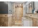 This bathroom features a step-in shower, tiled walls, and a sleek vanity for a modern and refined design at 402 W Clinton St, Danville, IN 46122