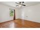 Empty bedroom featuring hardwood floors and a window at 402 W Clinton St, Danville, IN 46122
