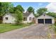 Home with a two-car garage and wide driveway at 402 W Clinton St, Danville, IN 46122