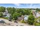 Aerial view capturing neighborhood street with houses, trees, and parked vehicles at 405 Harlan St, Indianapolis, IN 46201