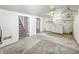 The basement features a stairwell, sink, and concrete flooring, with a walkout at 405 Harlan St, Indianapolis, IN 46201
