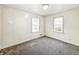 This bedroom offers a spacious layout and lots of natural light at 405 Harlan St, Indianapolis, IN 46201