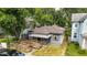 Aerial front view of the home featuring a wooden ramp and lattice-covered porch at 405 Harlan St, Indianapolis, IN 46201