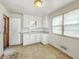 This kitchen offers ample cabinet space and natural light at 405 Harlan St, Indianapolis, IN 46201