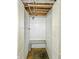 Small basement shower with block walls and an open ceiling at 405 Harlan St, Indianapolis, IN 46201