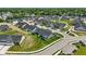 A picturesque aerial view of a community featuring manicured lawns and neatly arranged single-Gathering homes at 4182 Hume Ave, Plainfield, IN 46168