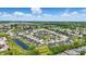 An aerial shot reveals a well-designed neighborhood with pond and lush greenery, creating a serene setting at 4182 Hume Ave, Plainfield, IN 46168