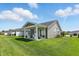 Lush backyard featuring a covered patio with outdoor seating at 4182 Hume Ave, Plainfield, IN 46168