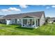 A covered patio offers a relaxing outdoor space with comfortable seating, perfect for enjoying the backyard at 4182 Hume Ave, Plainfield, IN 46168