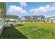 View of the back of the house with a covered patio and backyard at 4182 Hume Ave, Plainfield, IN 46168