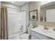 Clean bathroom featuring a shower-tub combo, vanity, and neutral decor at 4182 Hume Ave, Plainfield, IN 46168