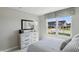 Comfortable bedroom with large window providing ample natural light and outside neighborhood views at 4182 Hume Ave, Plainfield, IN 46168