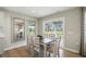Dining area featuring a modern table set, neutral decor, and a view of the backyard at 4182 Hume Ave, Plainfield, IN 46168