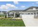 Charming single-story home featuring stone accents, gray siding, a well-manicured lawn, and a two-car garage at 4182 Hume Ave, Plainfield, IN 46168