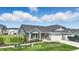 Charming home exterior with beautiful landscaping and attached two-car garage at 4182 Hume Ave, Plainfield, IN 46168
