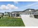 Well-maintained home exterior with beautiful landscaping, stone accents, and attached two-car garage at 4182 Hume Ave, Plainfield, IN 46168