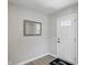Bright foyer featuring a stylish mirror, a white front door, and a neutral color palette at 4182 Hume Ave, Plainfield, IN 46168