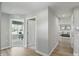 Hallway with wood-look floors leading to a study and the living room at 4182 Hume Ave, Plainfield, IN 46168