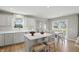 Bright eat-in kitchen featuring white cabinets, a center island, and stainless steel appliances at 4182 Hume Ave, Plainfield, IN 46168